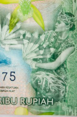 Endonezya banknotundaki Gong Dansı 'nın Macro fotoğrafı. 20 bin rupia..