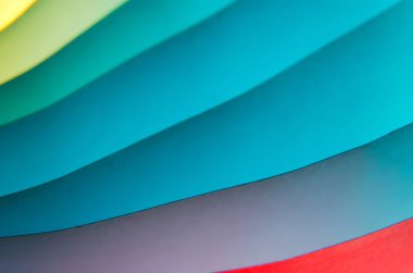 Abstract colorful macro background, made with white paper sheets and colorful lights.