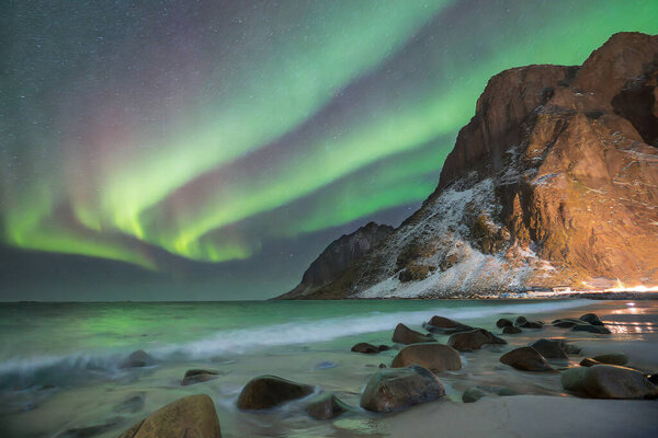 Aurora borealis northern lights over Lofoten islands, Norway
