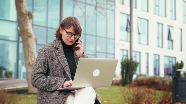 Slow Motion Shot Caucasian Businesswoman Glasses Working Laptop Talking Phone — Stock Video