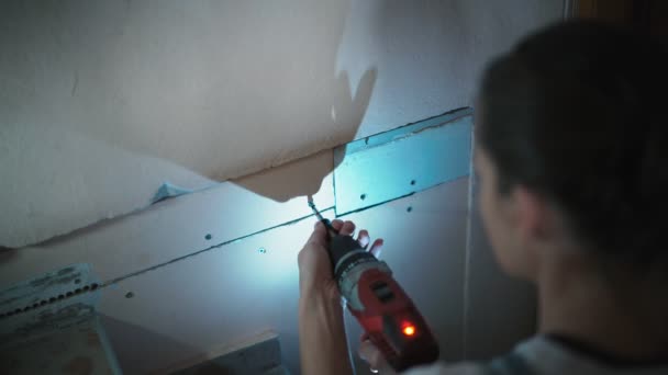 Young Caucasian Woman Using Cordless Screwdriver Renovation Home Improvement — стоковое видео