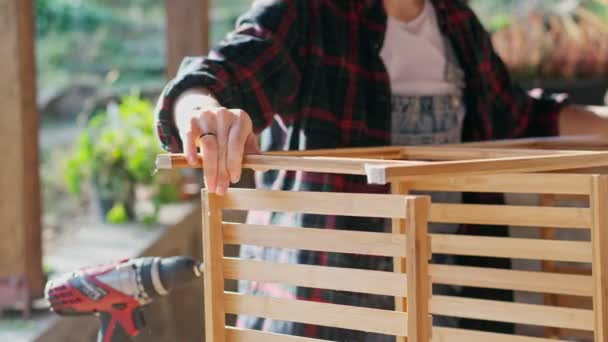 Woman Doing Diy Project Close Woman Assembling Wooden Shelf Outdoors — Stockvideo