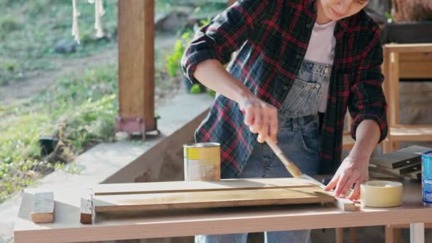 Close Slow Motion Footage Person Using Brush Varnish Wooden Board — Stockvideo