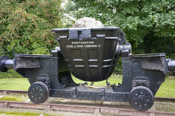 stock image Irlam, Manchester, UK, August, 26, 2024: Historic steel and iron casting ladle on display in a park.