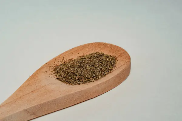 a wooden scoop of hemp powder on a spoon