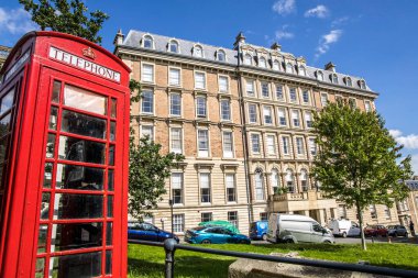 Bristol, UK- August 15, 2023: Historic Bridge House in Clifton and Red British Phone box. clipart