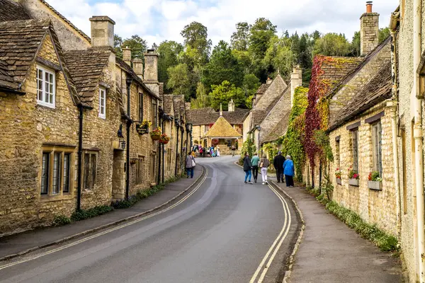 stock image Castle Combe, UK - September 23, 2023: Row of cottages in the picturesque Cotswolds village