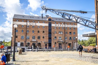 Gloucester, UK- August 19, 2023: Gloucester Docks at Sharpness Canal. The docks include fifteen Victorian warehouses. Lock Warehouse clipart