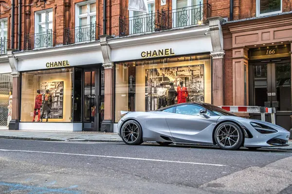 stock image London, UK- August 19, 2023: Facade of Chanel famous store in Sloane street with McLaren 720s parked in front.