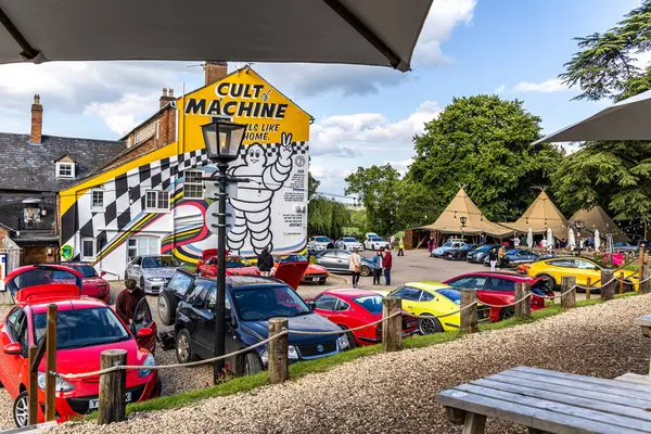 stock image Ettington , UK - June 5, 2024: Popular Caffeine and Machine The Hill Car Enthusiast meeting place. A Vies from outside eating area.