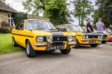 Bristol, UK- August 23, 2023: 1972 Yellow Hillman Avengers at a car meet. clipart