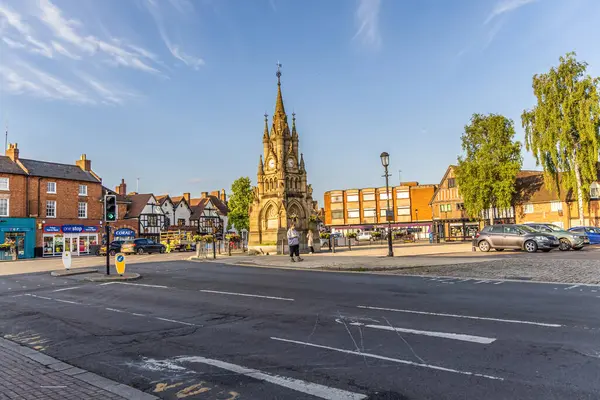 stock image Stratford-upon-Avon, UK - June 5, 2024: City center around The Shakespeare Memorial Fountain and Street and Tudor houses.