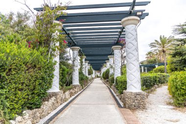 Rhodes, Greece Beautiful pillar walkway buildings at Kalithea Springs constructed in the 1930s. clipart