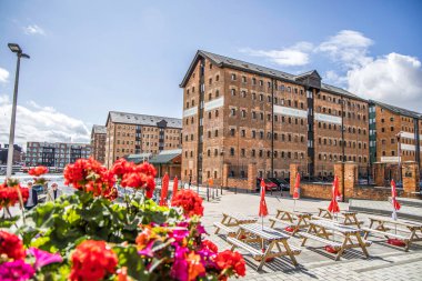 Gloucester, UK- August 19, 2023: Gloucester Docks at Sharpness Canal. The docks include fifteen Victorian warehouses clipart