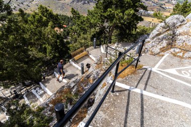 Rhodes, Greece - May 9, 2024: Holy Monastery of the Virgin Mary Tsambika Kyra Psili 300 white steps to reach it. clipart