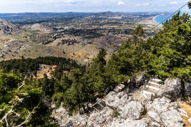 Holy Monastery of the Virgin Mary Tsambika Kyra Psili 300 white steps to reach it. clipart