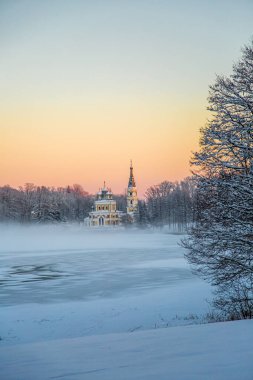 Old church Orthodox Christian church at frozen lake Stameriena. clipart