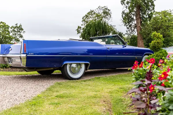 stock image Bristol, UK- August 11, 2024: Side of Blue Cadillac DeVille Convertible most luxurious and iconic model produced by Cadillac in 1970s