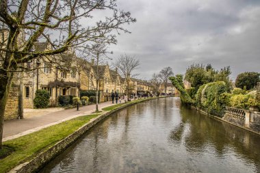 Bourton On Water, UK - May 10, 2023: Town center and river Windrush, Cotswold's. clipart