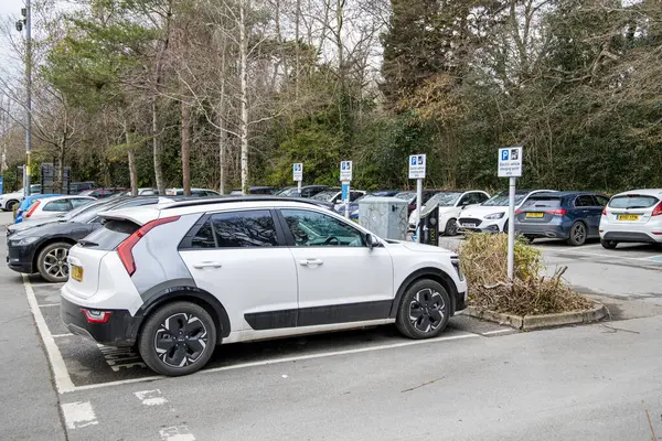 stock image Bath, UK - January 8, 2023: A white Kia Niro EV parked in a car park with electric vehicle charging points.