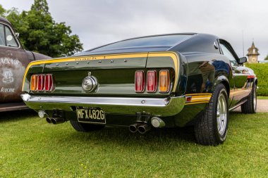 Bristol, UK- August 11, 2024: Rear of Dark Green Ford Mustang 1969 Mach 1. clipart