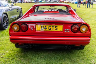 Bristol, UK- August 11, 2024: Rear of Red FERRARI 328 GTS 1989 coupe, old timer meeting. clipart