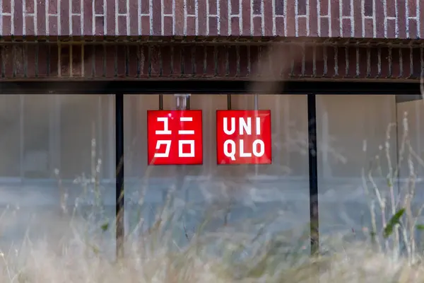 stock image London, UK- September 19, 2024: UNIQLO store storefront with red signage.