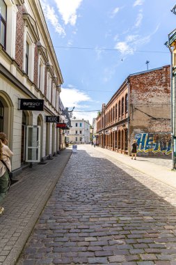 Liepaja, Latvia - June 13, 2024: Old houses with cobbled streets of Liepaja. clipart