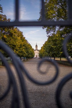 London, UK - September 14, 2023: View through the Royal Avenue of Burtons Court Of London Royal Hospital through gate. Designed by Sir Christopher Wren. clipart