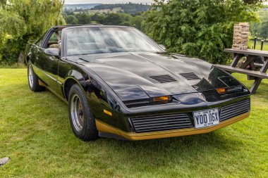 Bristol, UK- August 11, 2024: Front side view of Black Pontiac Firebird Trans Am third generation, which was produced between 1982 and 1992. From Knight Rider KITT. clipart