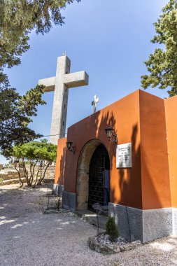 Rhodes, Greece - May 9, 2024: cross and the observation deck on the mount filerimos. clipart