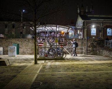 Bristol, England UK - February 12 2023: Bicycle, Bike storage facilities at Temple Meads train station at night. clipart