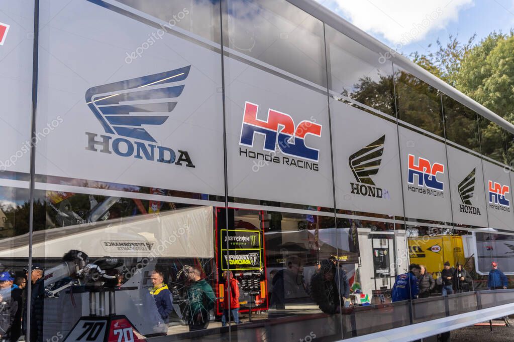 Winchester, UK- October 5, 2024: Modern Honda Racing HQ with floor to ceiling windows presenting official HRC gear for fans and riders.