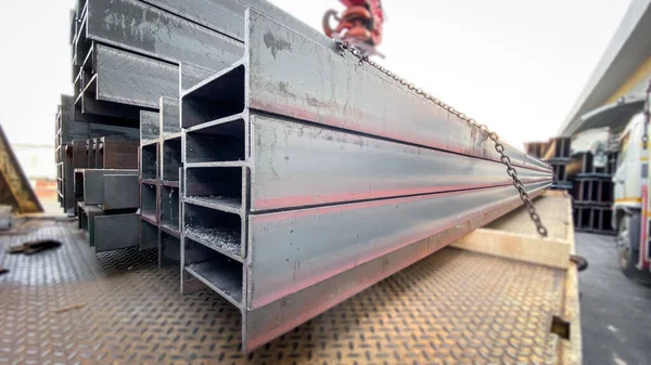 H-beam Steel.Steel beams production. Metal profile beam Steel in packs at the warehouse of metal products, thailand