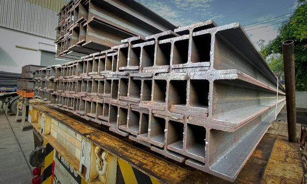 Steel beams production. Metal profile beam Steel in packs at the warehouse of metal products, thailand