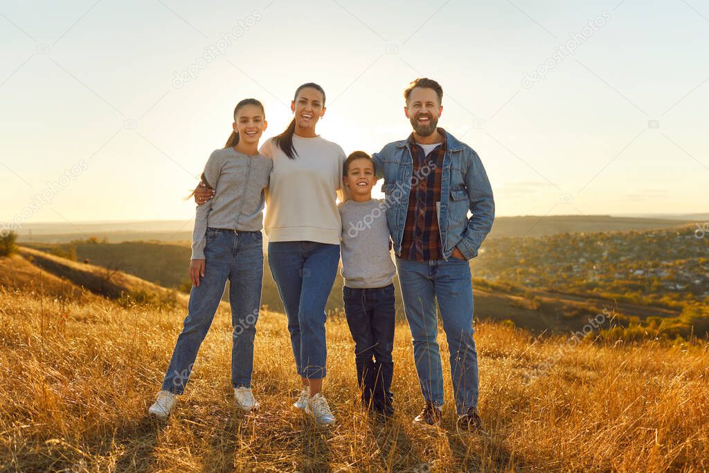 Portrait of a family spending leisure time, weekends, or vacations strolling in nature beyond the city. Smiles abound, creating cherished moments of togetherness and travel adventures.