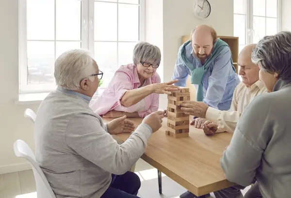 Group Senior Men Women Playing Together Wooden Building Blocks Dementia Royalty Free Stock Images