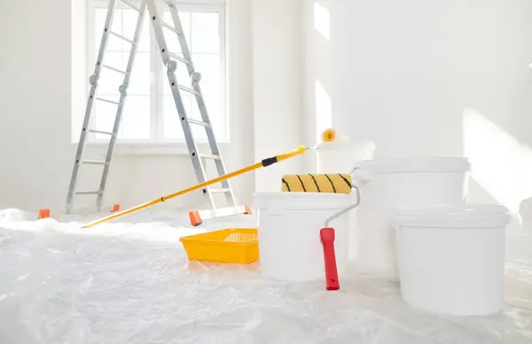 Close Buckets Paint Rollers Standing Empty New House Freshly Painted Royalty Free Stock Photos