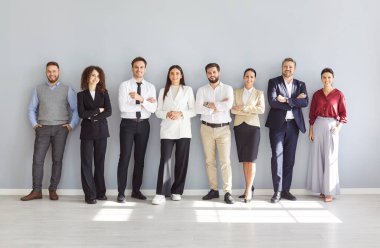 Diverse HR interviewers, happy smiling office people standing in row, waiting for meeting, potential employers hiring, supervising, group, corporate company staff team welcoming, professional teamwork