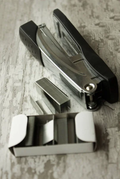 metal silver staples for a stapler close-up. Stapler and staples