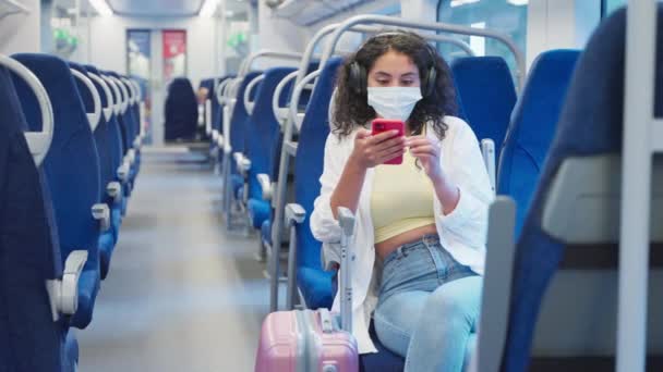 Portrait Female Passenger Train Pandemic Covid Woman Using Smartphone Headphones — Stock Video