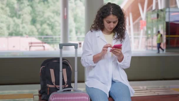 Student Girl Waiting Train Suburban Platform Railway Station Using Smartphone — Stock Video