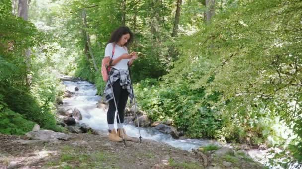 Woman Hiker Looking Her Route Map Phone Walking Forest Curly — Stock Video