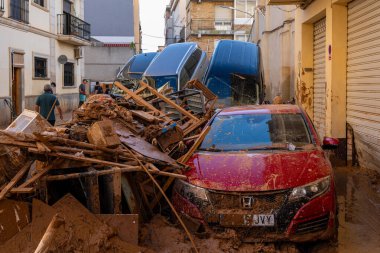 Photo shows the aftermath of the recent flood in Alfafar, Valencia, Spain. Captured are damaged homes, roads, cars and the efforts of residents, emergency services and volunteers to clean and rebuild. clipart