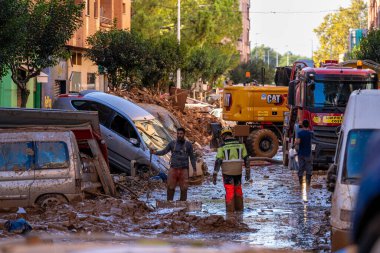 Photo shows the aftermath of the recent flood in Alfafar, Valencia, Spain. Captured are damaged homes, roads, cars and the efforts of residents, emergency services and volunteers to clean and rebuild. clipart