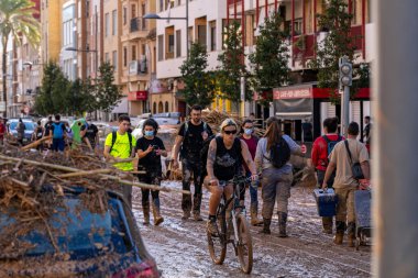 Photo shows the aftermath of the recent flood in Alfafar, Valencia, Spain. Captured are damaged homes, roads, cars and the efforts of residents, emergency services and volunteers to clean and rebuild. clipart