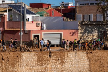 Photo shows the aftermath of the recent flood in Alfafar, Valencia, Spain. Captured are damaged homes, roads, cars and the efforts of residents, emergency services and volunteers to clean and rebuild. clipart