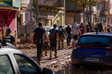 Photo shows the aftermath of the recent flood in Alfafar, Valencia, Spain. Captured are damaged homes, roads, cars and the efforts of residents, emergency services and volunteers to clean and rebuild. clipart