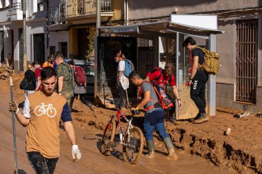 Photo shows the aftermath of the recent flood in Alfafar, Valencia, Spain. Captured are damaged homes, roads, cars and the efforts of residents, emergency services and volunteers to clean and rebuild. clipart