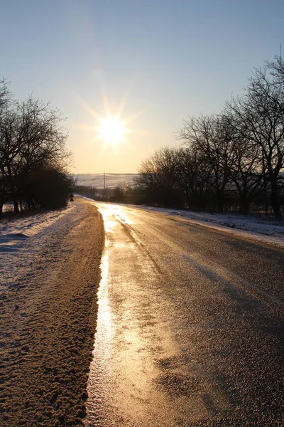 winter road with sun and snow